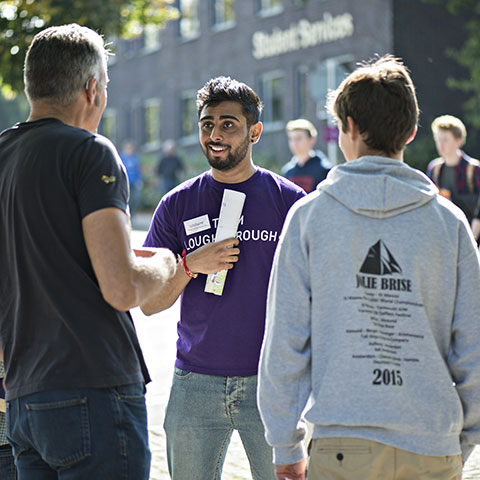 Student helping during an open day